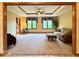Bright living room featuring neutral carpet, decorative ceiling, two windows, and comfortable furniture at 1544 Olive Branch Cir, Greenwood, IN 46143