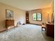 Spacious living room with ample natural light from a large window and classic furniture at 1544 Olive Branch Cir, Greenwood, IN 46143