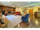 Large living room featuring a cozy fireplace, built-in shelving, and a convenient wet bar at 1544 Olive Branch Cir, Greenwood, IN 46143