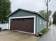 Spacious detached garage with dark brown door, matching the home's exterior siding at 1567 Logan St, Noblesville, IN 46060