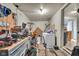 An unfinished basement with washer, dryer, and workbench, offering potential for storage or customization at 1617 E Kelly St, Indianapolis, IN 46203