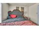 Bedroom featuring a decorative headboard and a nightstand, offering a cozy and comfortable living space at 1617 E Kelly St, Indianapolis, IN 46203
