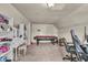 This is a bedroom featuring a billiard table, desk, and ample storage space at 1617 E Kelly St, Indianapolis, IN 46203