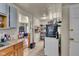 Kitchen featuring a range, refrigerator, and view to the dining room at 1617 E Kelly St, Indianapolis, IN 46203