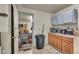 Kitchen featuring a microwave, toaster oven, and wooden cabinets at 1617 E Kelly St, Indianapolis, IN 46203