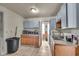 This kitchen has wooden cabinets and tile floors at 1617 E Kelly St, Indianapolis, IN 46203