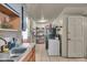 Kitchen featuring an oven, refrigerator, sink, cabinets, and tiled floor at 1617 E Kelly St, Indianapolis, IN 46203