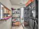 This kitchen has an open shelf and a black refrigerator at 1617 E Kelly St, Indianapolis, IN 46203