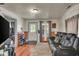 Relaxing living room with hardwood floors, comfy sofa, and natural light from large windows at 1617 E Kelly St, Indianapolis, IN 46203