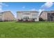 Expansive backyard featuring a wooden deck and lush green lawn, perfect for outdoor activities and relaxation at 16264 Red Clover Ln, Noblesville, IN 46062