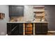 Basement wet bar featuring stone backsplash, dark cabinets, and a unique barrel design at 16264 Red Clover Ln, Noblesville, IN 46062