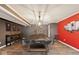 Recreation room featuring a pool table with gray walls, a red accent wall, and decorative lighting at 16264 Red Clover Ln, Noblesville, IN 46062