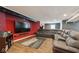 Finished basement with a large sectional sofa, media center, and a Star Wars themed rug at 16264 Red Clover Ln, Noblesville, IN 46062