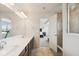 Bathroom with double sinks, vanity with granite countertop, and a tiled walk-in shower at 16264 Red Clover Ln, Noblesville, IN 46062