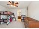 Shared bedroom featuring bunkbeds, dresser, ceiling fan, and carpet flooring at 16264 Red Clover Ln, Noblesville, IN 46062