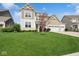 Lovely two-story home with lush green lawn and inviting curb appeal at 16264 Red Clover Ln, Noblesville, IN 46062