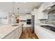 Modern kitchen featuring white cabinetry, stainless steel appliances, and granite countertops at 16264 Red Clover Ln, Noblesville, IN 46062
