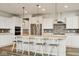 Modern kitchen with white cabinetry, stainless steel appliances, and granite countertops at 16264 Red Clover Ln, Noblesville, IN 46062