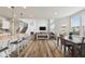 Spacious open-concept living area with fireplace and kitchen island seating at 16264 Red Clover Ln, Noblesville, IN 46062