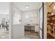 Home office nook with built-in desk and natural light, located off kitchen at 16264 Red Clover Ln, Noblesville, IN 46062