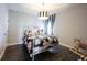 Stylish bedroom with black and white patterned decor, hardwood floors, and a metal frame bed with floral bedding at 1648 Rossmay Dr, Westfield, IN 46074