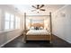 Bright bedroom featuring a four-poster bed, complemented by natural light from shuttered windows at 1648 Rossmay Dr, Westfield, IN 46074