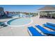 Community pool with lounge chairs, umbrellas, and picnic tables at 1648 Rossmay Dr, Westfield, IN 46074