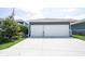 Spacious two-car garage with a wide driveway and well-maintained landscaping at 1648 Rossmay Dr, Westfield, IN 46074