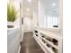 Inviting hallway with built-in shelves and decorative accents leading to the front door at 1648 Rossmay Dr, Westfield, IN 46074