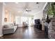 Open-concept living room featuring a stone fireplace and lots of natural light at 1648 Rossmay Dr, Westfield, IN 46074