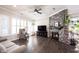 Inviting living room with stone fireplace, ceiling fan, and plenty of seating at 1648 Rossmay Dr, Westfield, IN 46074