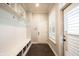 Functional mudroom with built-in bench, storage cubbies, and access to the garage at 1648 Rossmay Dr, Westfield, IN 46074