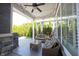 Serene outdoor patio with string lights, wicker furniture, and lush greenery at 1648 Rossmay Dr, Westfield, IN 46074