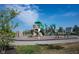 Charming community playground with slides, climbing structures, and a bench for relaxation at 1648 Rossmay Dr, Westfield, IN 46074