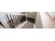 Carpeted staircase with white risers and a dark wood handrail, providing a stylish transition between floors at 1648 Rossmay Dr, Westfield, IN 46074