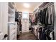 Organized walk-in closet with custom shelving, drawers, and hanging rods for maximum storage and convenience at 1648 Rossmay Dr, Westfield, IN 46074