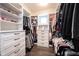 Spacious walk-in closet with custom built-ins, providing ample storage for clothing, shoes, and accessories at 1648 Rossmay Dr, Westfield, IN 46074
