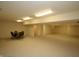 Finished basement with neutral carpet, recessed lights, and a seating area at 17003 Whitebark Ct, Westfield, IN 46074