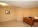 This finished basement features neutral carpet and a wood desk with decor at 17003 Whitebark Ct, Westfield, IN 46074