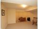 Spacious finished basement with desk and chair, offering flexible living space at 17003 Whitebark Ct, Westfield, IN 46074