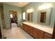 Spacious bathroom with a double vanity, tile flooring, and a walk-in closet at 17003 Whitebark Ct, Westfield, IN 46074