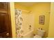 Bright bathroom features a shower with a colorful fish themed shower curtain at 17003 Whitebark Ct, Westfield, IN 46074