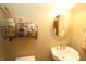 A close-up of a bathroom featuring a unique pedestal sink and decorative wall shelving at 17003 Whitebark Ct, Westfield, IN 46074