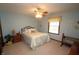 Comfortable bedroom featuring carpet, ceiling fan, and a window to let the light in at 17003 Whitebark Ct, Westfield, IN 46074