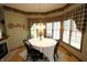 Bright dining room with a chandelier, bay window, and cozy decor at 17003 Whitebark Ct, Westfield, IN 46074