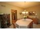 Warm dining room with an octagonal table, chandelier, and access to other rooms at 17003 Whitebark Ct, Westfield, IN 46074