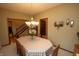 Elegant dining room with a chandelier, seating for eight, and views into other rooms of the home at 17003 Whitebark Ct, Westfield, IN 46074