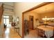 Bright dining room with hardwood floors, chandelier, and views into the living room at 17003 Whitebark Ct, Westfield, IN 46074
