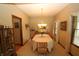 Spacious dining room with seating for eight, warm lighting, and classic decor throughout at 17003 Whitebark Ct, Westfield, IN 46074