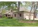 Three car garage on a well maintained house with manicured lawn and professional landscaping at 17003 Whitebark Ct, Westfield, IN 46074